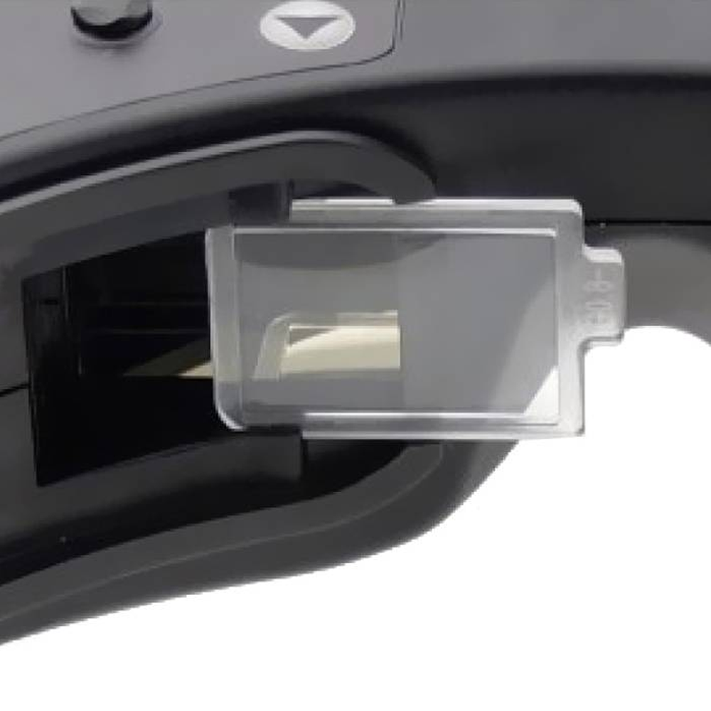 Close-up of diopter lens inserted into Fat Shark analog FPV goggle lens holder for vision correction