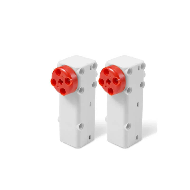 Front three-quarter view of two upright white DSpower DS-E025A servo motors with red circular output hubs.