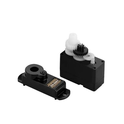 DS-S001 servo opened to show the internal white and black plastic gear train beside its removed top cover.
