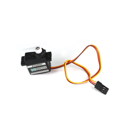 ATOMRC S09P 9g digital servo with white servo horn and 3-pin lead, angled view on white background