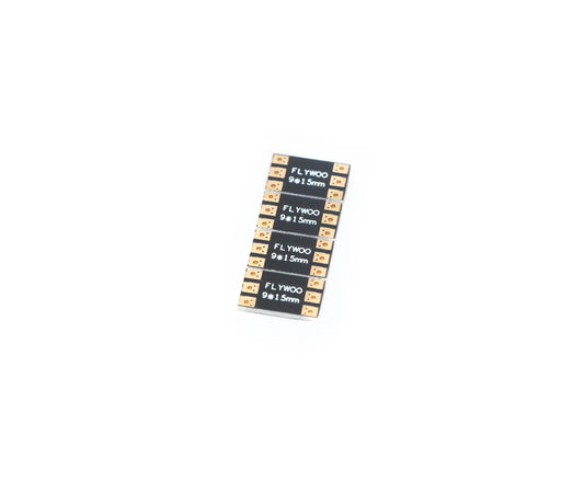 Stack of FLYWOO 9x15mm frame arm boards with solder pads on both ends for FPV drone builds