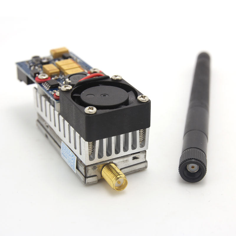 RP-SMA antenna connector close-up on FPV transmitter heatsink, antenna shown beside unit