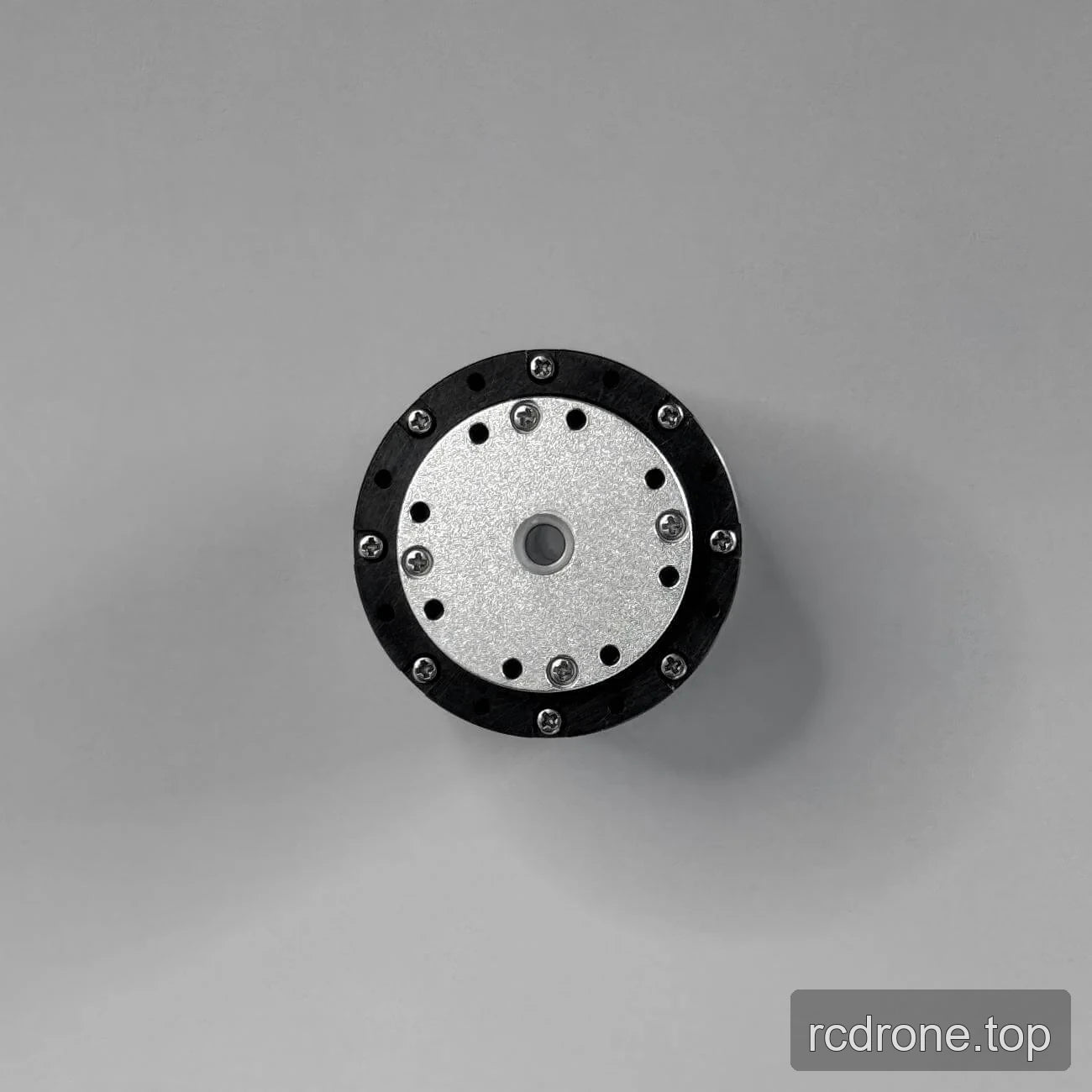PH08 output face with central opening, mounting holes, and black ring