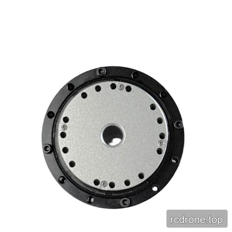 Close view of the motor faceplate showing the central opening and concentric rings of mounting holes