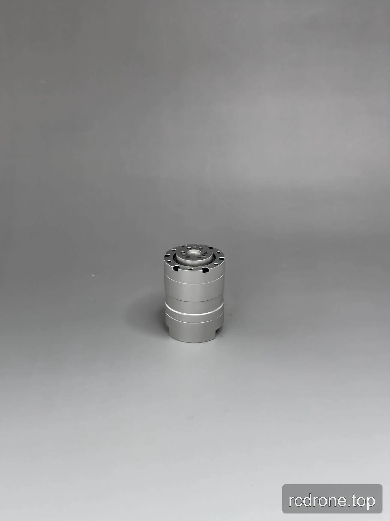 Upright view of a silver cylindrical motor housing