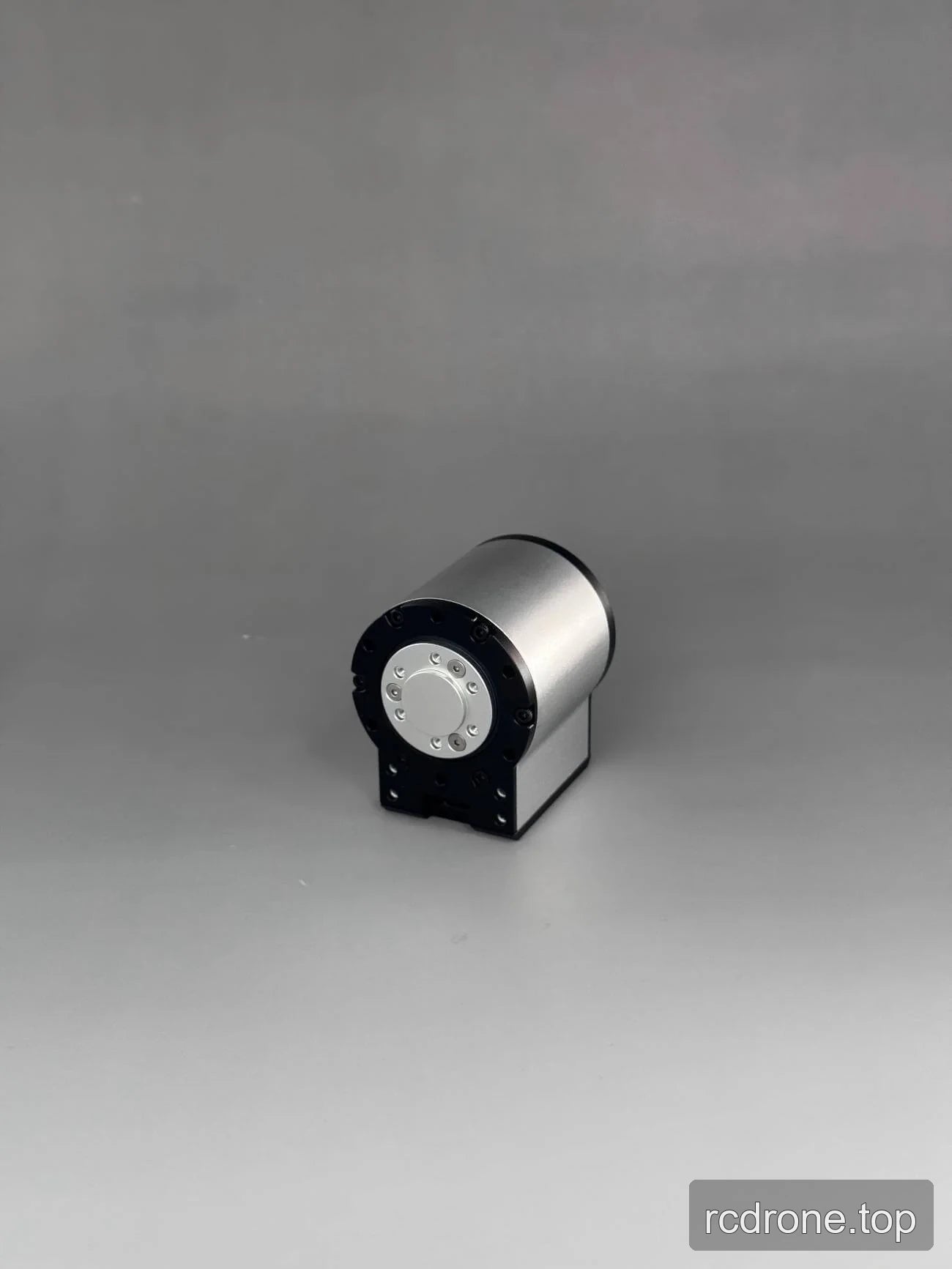Cylindrical motor assembly with an angled black mounting bracket
