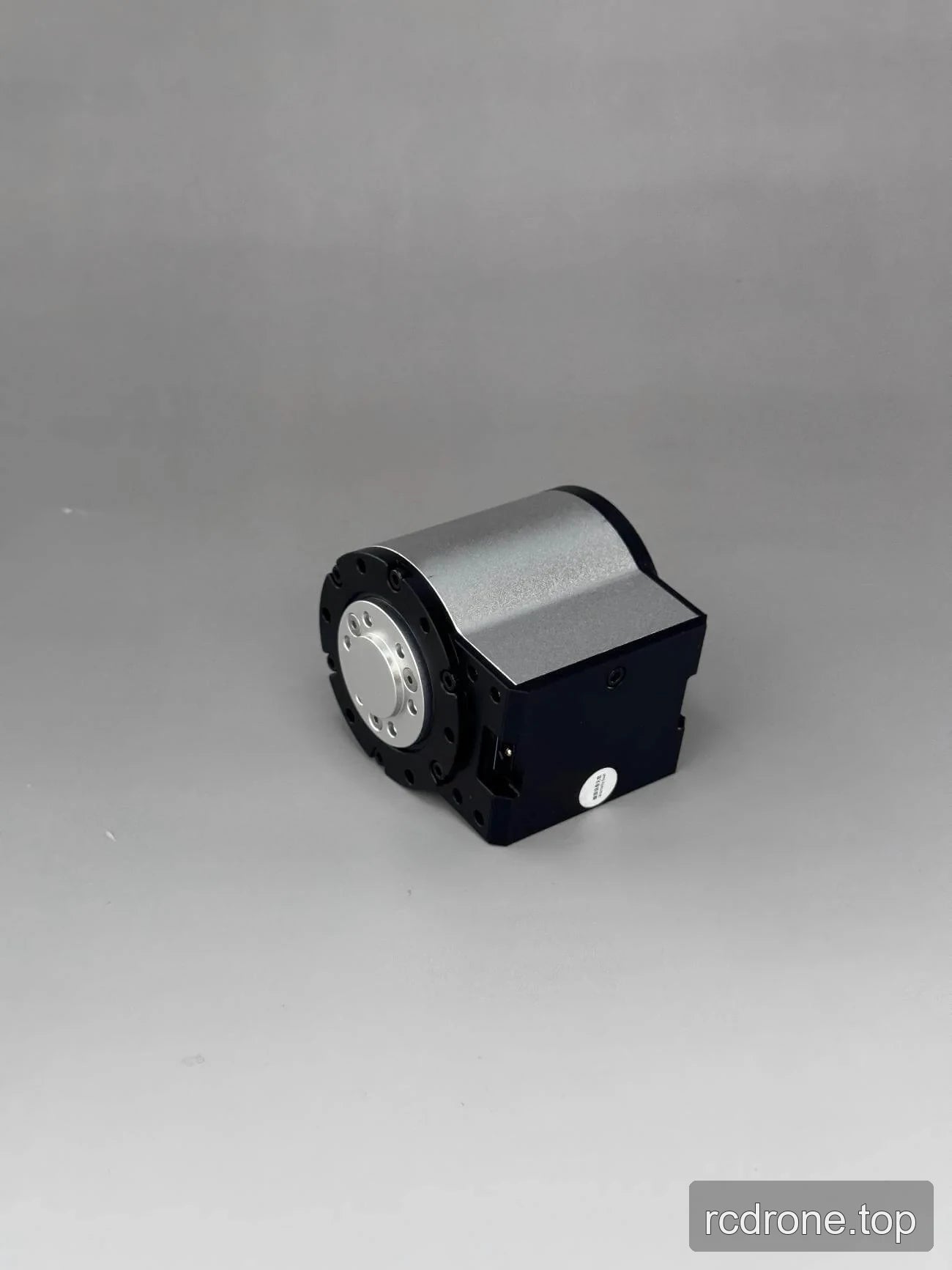 Enclosed motor assembly with silver cover and black mounting base