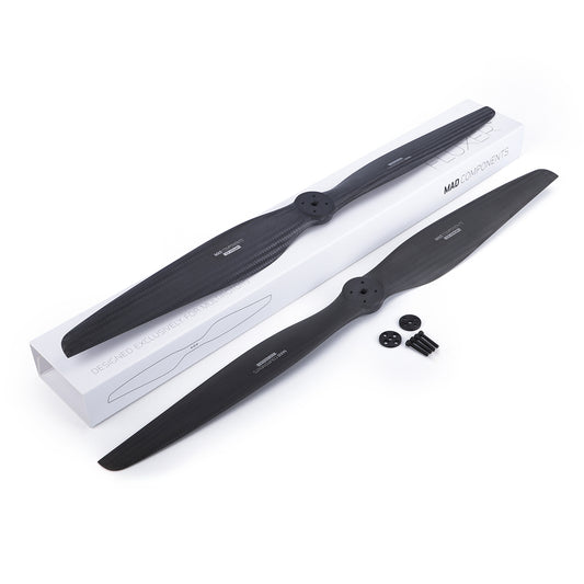 MAD FLUXER carbon fiber eVTOL propeller (CCW) with mounting bolts and washers beside MAD Components box