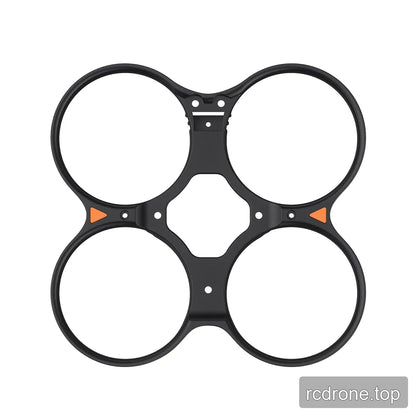Black four-duct propeller guard with orange side accents and central mounting holes on white.