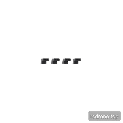 Four matching black landing pad pieces with small rectangular openings, arranged in a horizontal row.