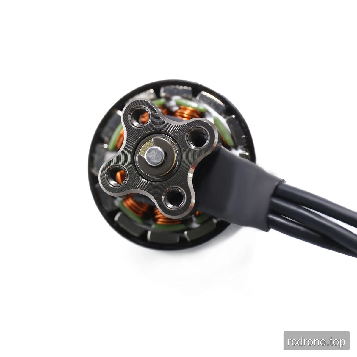 Close-up of the GEPRC GR1404 motor underside with four-hole mounting plate, central shaft end, copper windings, and wires.