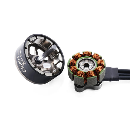 Disassembled GEPRC GR1404 motor showing the bell, shaft, magnets, copper windings, bearing, and lead wires.