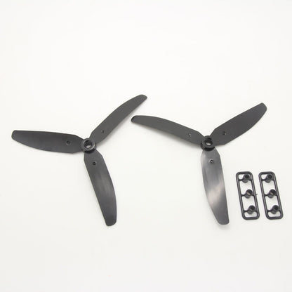 Two black 3-blade propellers showing opposite rotation directions, with mounting hardware strips