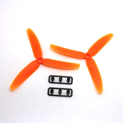 Orange 3-blade propeller pair with two small mounting hardware strips