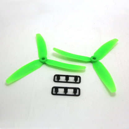 Green 3-blade propeller pair with two small mounting hardware strips on white background