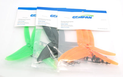 Gemfan propeller packs with blister bags showing green, black, and orange 3-blade props