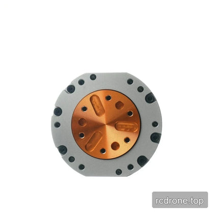 Front-facing close view of the HEXMOTOR 4310 orange circular mounting plate with holes and surrounding fasteners.