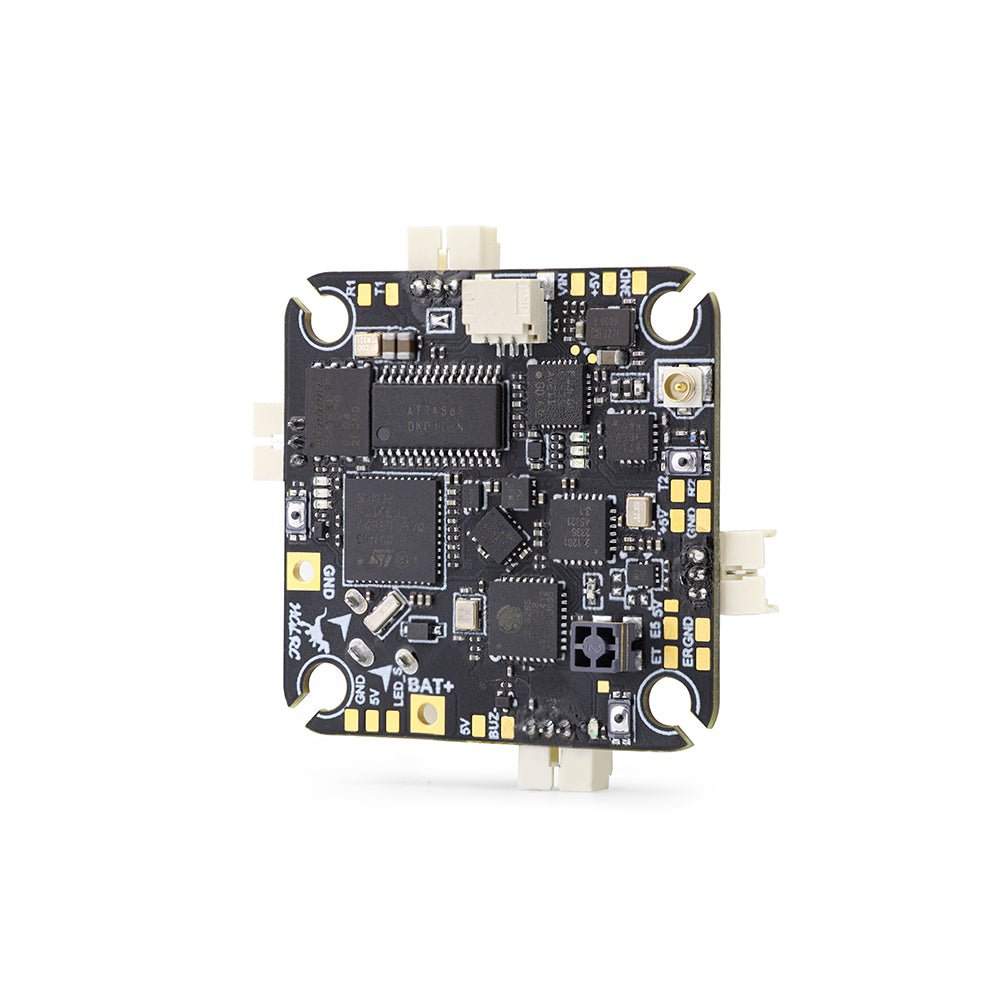 Bottom side of HGLRC SPECTER F411 12A AIO board showing wiring pads, chips, and connectors