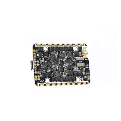 HGLRC SPECTER F722 AIO FC/ESC underside at angle, showing ESC components and solder pads