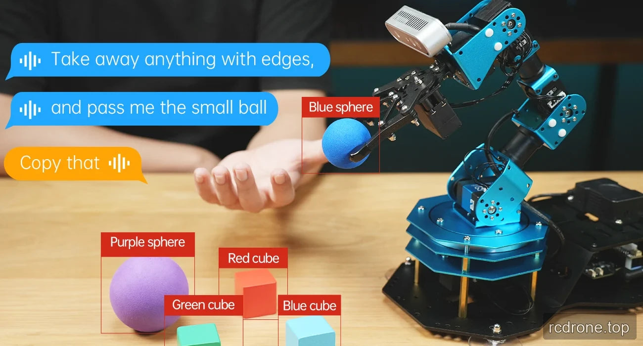 ArmPi Ultra handing a blue sphere toward an open hand beside labeled colored shapes