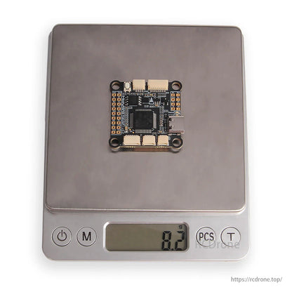 Holybro Kakute F722 Flight Controller weighs 8.2 grams on digital scale.