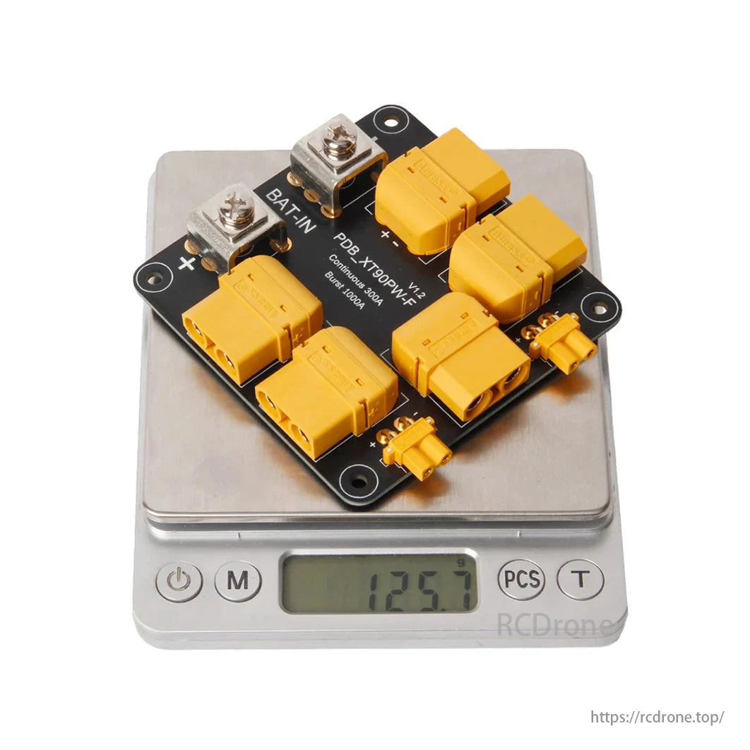Holybro PDB 300A with XT90 connectors has a scale weight of 125.7 grams.