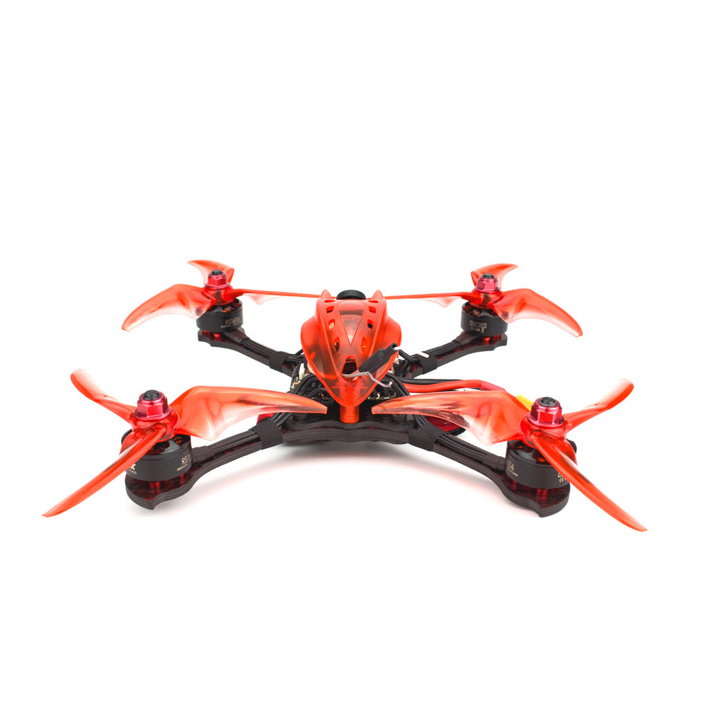 Emax Babyhawk R Pro 4 inch FPV drone head-on angle showing four motors, arms, and orange propellers