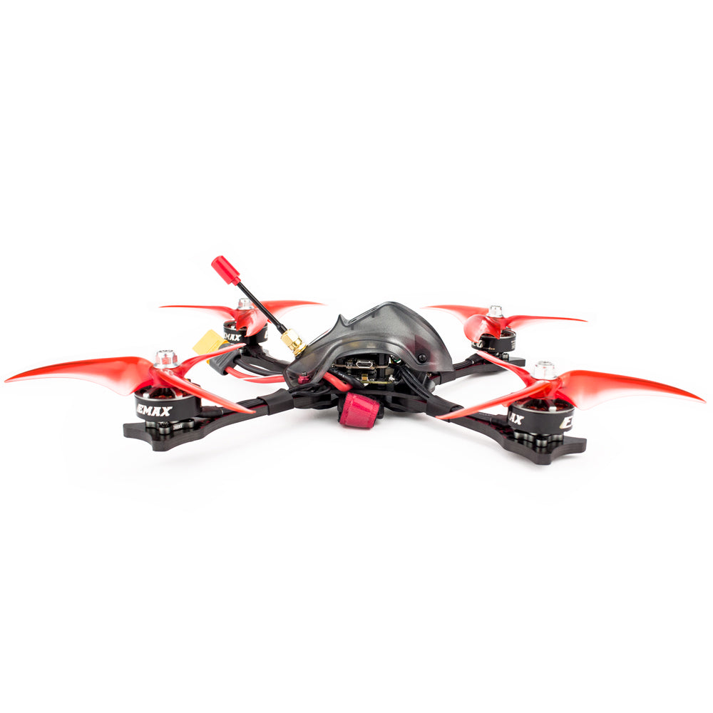 Low side profile of the quadcopter showing canopy, frame arms, battery strap and power lead