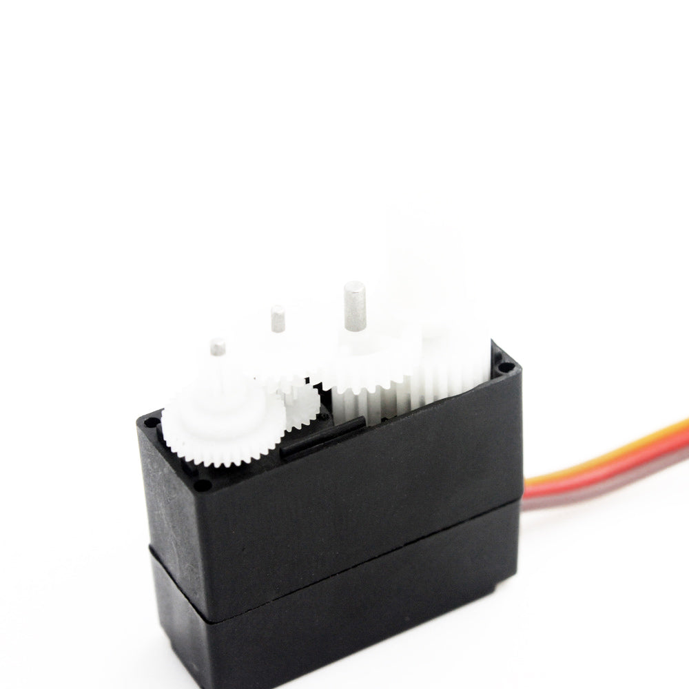 Servo with top cover removed showing white plastic gear set and output shaft