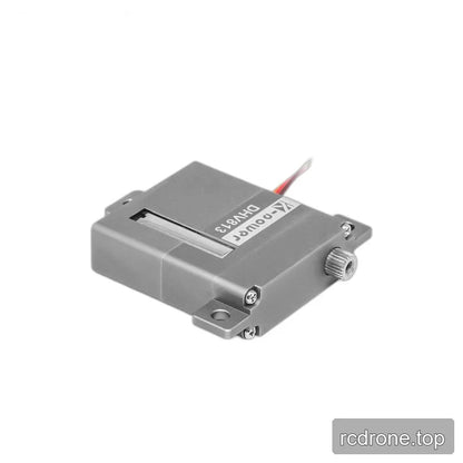 Gray servo lying diagonally, showing its shallow casing, right-facing splined shaft, mounting tabs, and casing screws.