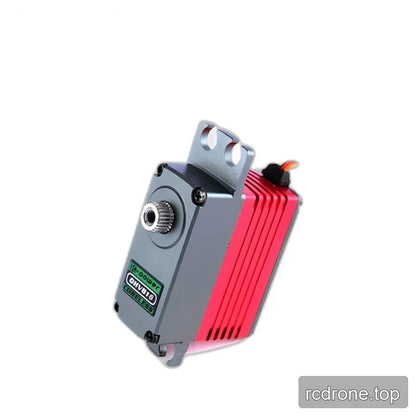 Tilted gray and pink-red servo showing its splined shaft, upper mounting slots and colored wire exiting the rear.