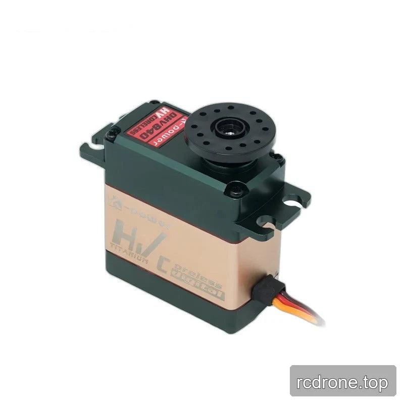 Green and gold servo with a black circular perforated horn mounted on top and a three-color cable exiting the side.