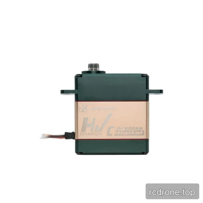 Servo side profile showing the gold HV TITANIUM coreless digital panel, green housing, upper shaft, and left cable.