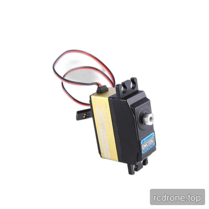 Upright black and gold DMC026 servo with a forward-facing silver shaft, looped lead and black connector behind the body.