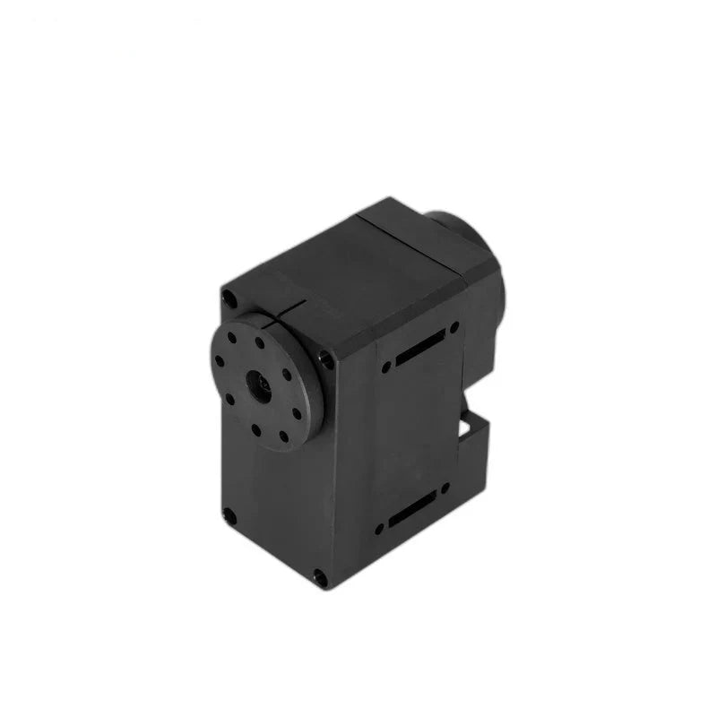 Elevated view of the black servo showing the top casing, circular output plate, corner screws, and side slots.