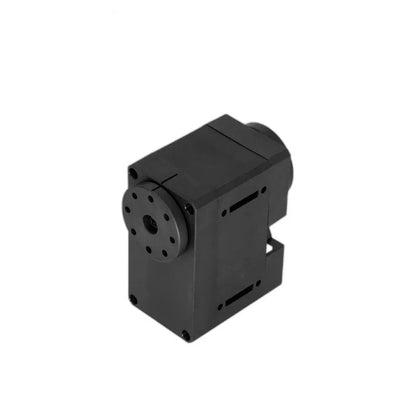 Elevated view of the black servo showing the top casing, circular output plate, corner screws, and side slots.