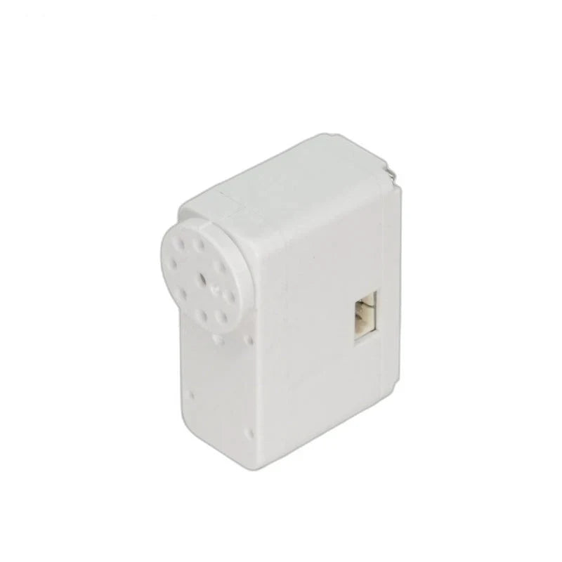 Angled view of the white servo showing its circular output disc, top casing and recessed side connector.