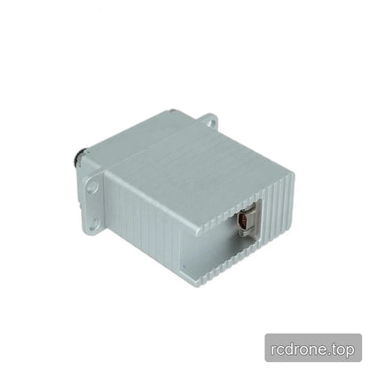 Rear angled view of the silver servo, showing a recessed multipin connector and grooves across the casing.