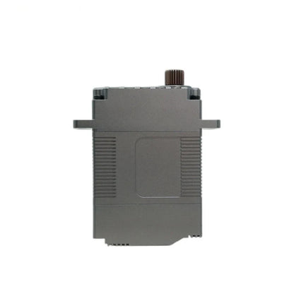 Straight side view of the gray servo housing with ribbed edges, a recessed panel, and output shaft projecting above.