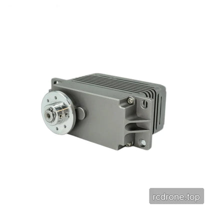 Horizontal gray servo with the circular output hub on the left, fins across the top, and mounting holes on the right.