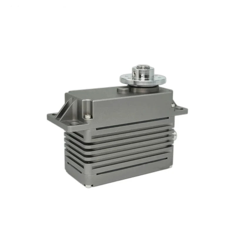 Gray servo motor viewed from the left corner, with horizontal housing fins, mounting ears, and a silver output hub.