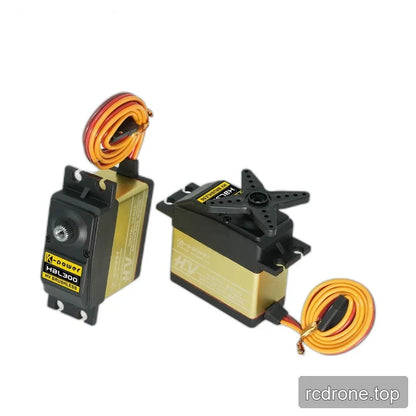 Two HBL300 servo views with coiled leads, showing a bare output shaft on the left and a fitted four-arm horn on the right.