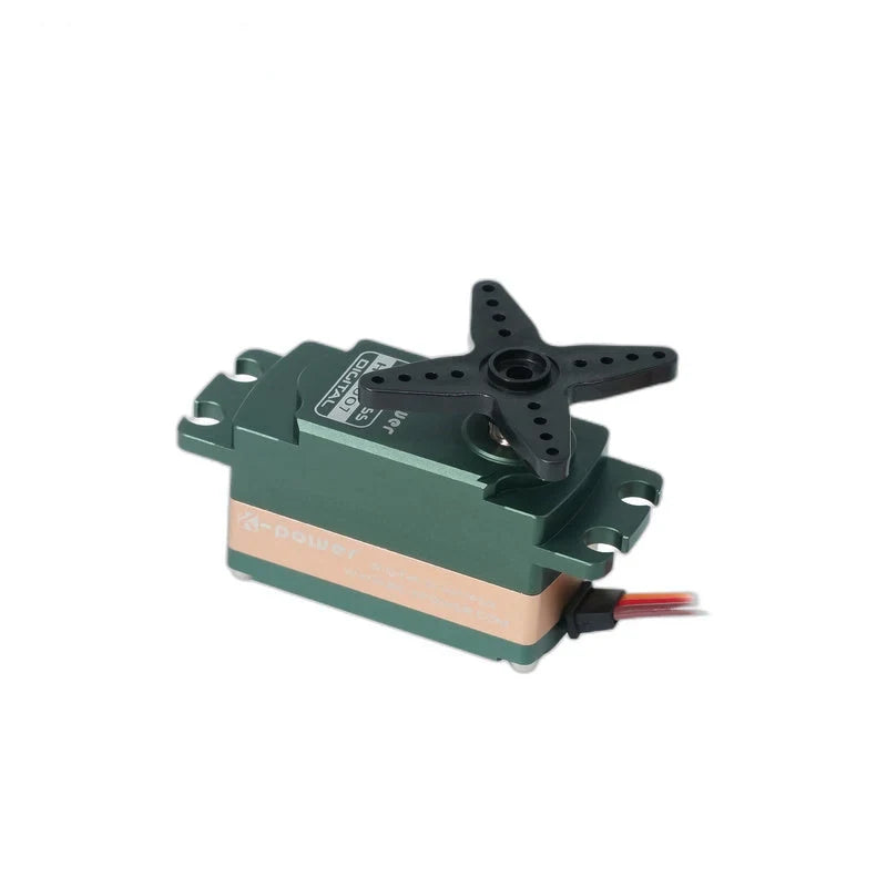 Side-angle view of the green servo with a copper-colored band, four-arm horn, mounting tabs, and wires extending right.