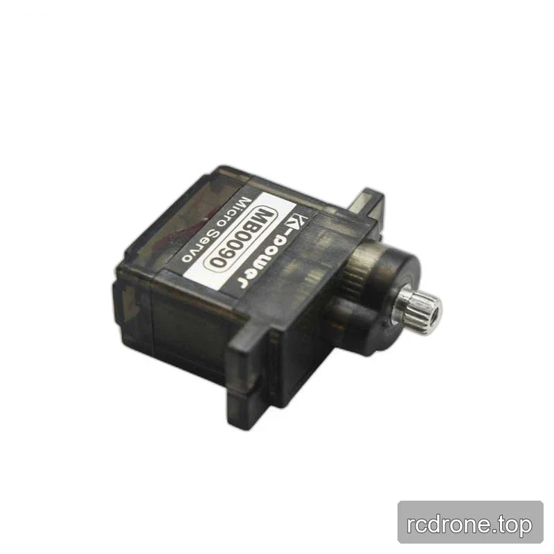 MB0090 servo lying diagonally with its label facing up, dark translucent casing, mounting tabs, and metal shaft pointing right.