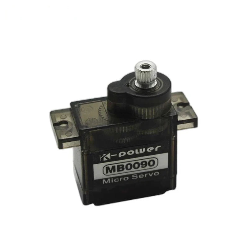 MB0090 micro servo viewed from the left, with a translucent dark housing, front label, mounting tabs, and metal shaft.