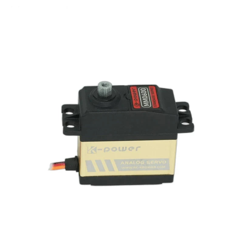 MM0600 servo with a gold side labeled ANALOG SERVO, exposed output shaft, black mounting tabs and wires extending left.