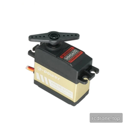 Black and gold servo in three-quarter view with an attached double-arm horn, mounting tabs and visible MM0600 label.
