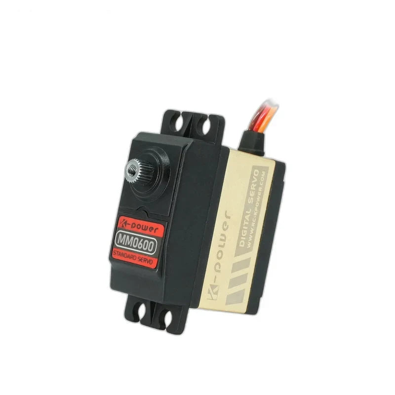 Black and gold MM0600 servo tilted upright with exposed splined shaft, mounting tabs and a side label reading DIGITAL SERVO.