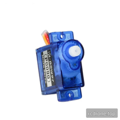 P0090 servo angled toward the white output shaft end, with gears visible through the blue case and slotted mounting tabs.