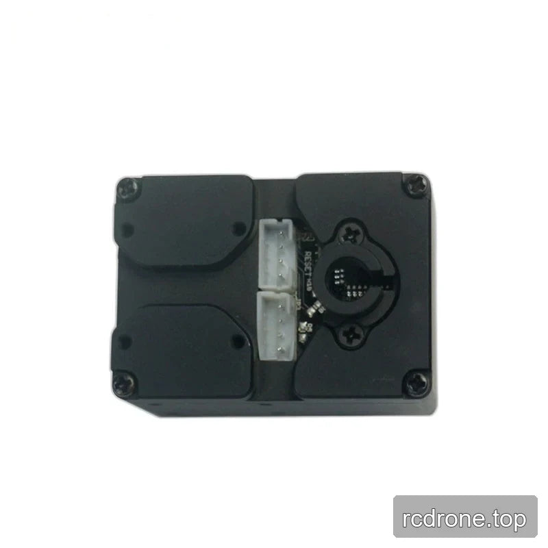 Servo face showing two white connectors, exposed circuit board sections, and a circular opening with retaining screws.